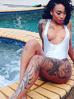 hot tattooed ebony stripping