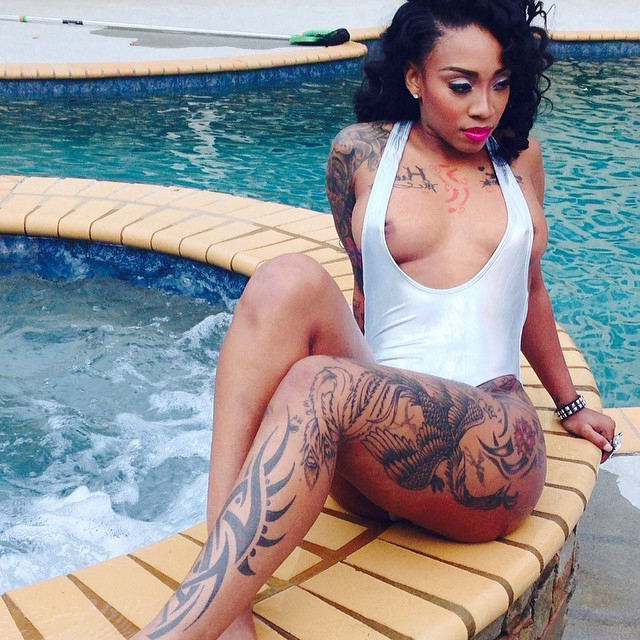 hot tattooed ebony stripping