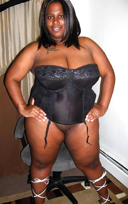 women in black lingerie shows her with an eye to pussy